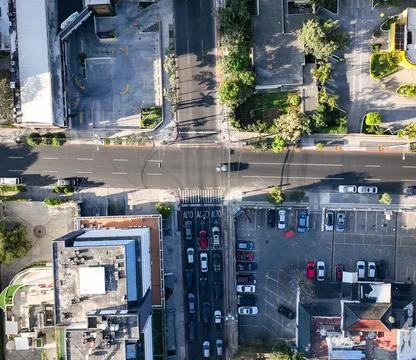 High-Angle View of Urban Streets with Parked Cars and Autumn Trees Stock Photos