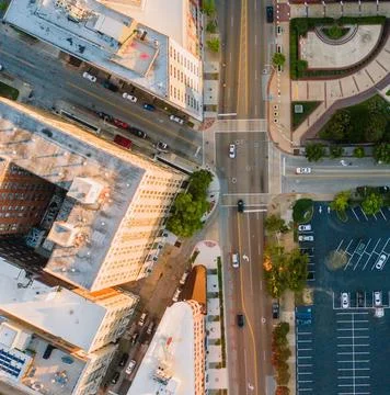 High-Angle View of Urban Streets with Parked Cars and Autumn Trees Stock Photos