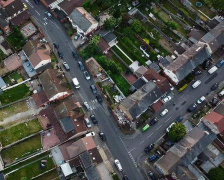 High-Angle View of Urban Streets with Parked Cars and Autumn Trees Stock Photos