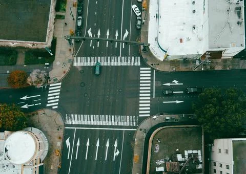 High-Angle View of Urban Streets with Parked Cars and Autumn Trees Stock Photos