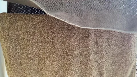 High Angle View of Various Carpet Fabric Texture Samples in Neutral Earth Tones Stock Footage 340898248