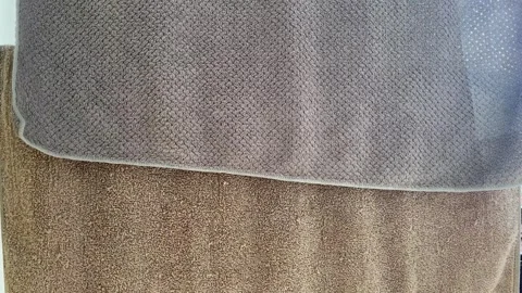 High Angle View of Various Carpet Fabric Texture Samples in Neutral Earth Tones Stock Footage 340898313