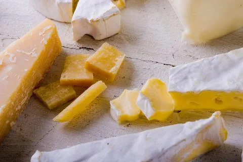 High angle view of various cheese on wooden table, copy space Stock Photos