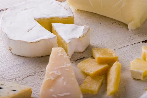 High angle view of various cheese on white table, copy space Stock Photos