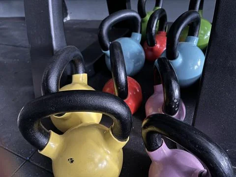 High angle view of various colorful kettlebells Stock Photos
