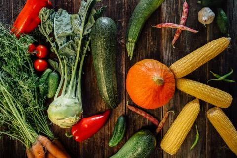 High angle view of various fresh vegetables on wooden table Stock Photos