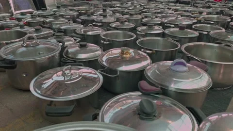 High-Angle View of Various Metal Cooking Pots Displayed on Floor at Outdoor.. Stock Footage 345444957