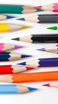 High angle view of various sharp colorful artist pencils scattered horizont.. Stock Photos
