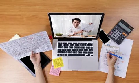 High angle view of video conference with teacher on laptop at home. Top view  Stock Photos