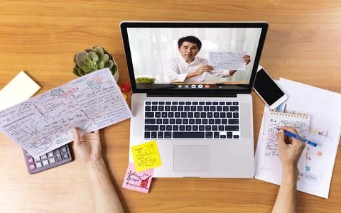High angle view of video conference with teacher on laptop at home. Top view  Stock Photos