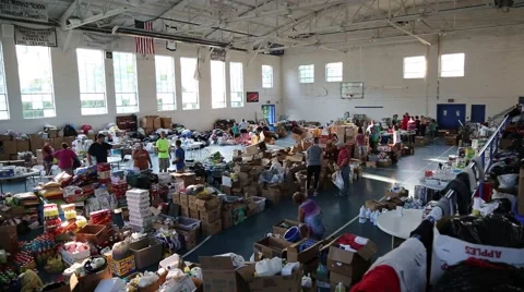 High Angle View of Volunteers and Relief Supplies in Building Stock Footage 64936823