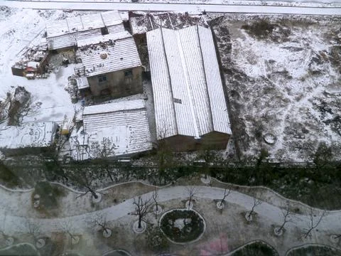 High Angle View of Warehouse with Snow in Winter Foto stock