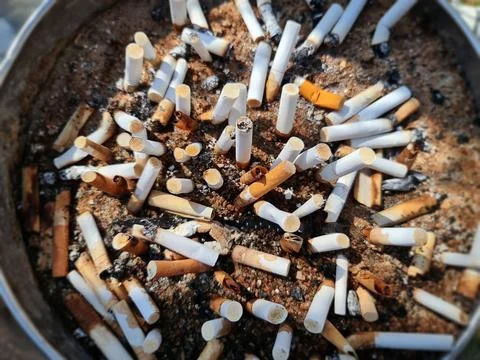 High Angle View of Waste Cigarette Butts with Selective Focus Foto stock