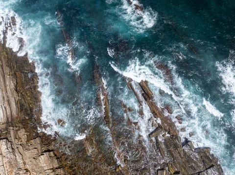 High angle view of water hitting rocks Stock Photos