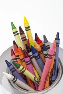 High angle view of wax crayons rolled up in silver paper Foto stock