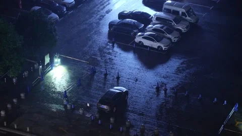 High Angle View of a Wet Parking Lot During a Heavy Night Rainstorm Stock Footage 341946114