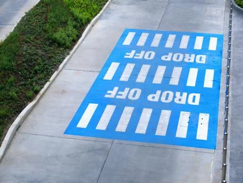 High Angle View of White Drop Off Texts on Blue Rectangular Area Stockfoto's