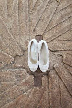 High angle view of white high heel shoes on concrete Stock Photos