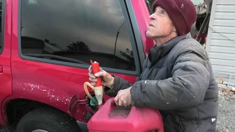 A High Angle View of a White Male Putting Fuel in a Car Stock-Footage 167187965