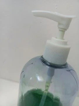 High Angle View of White Pump Head on Clear Soap Bottle Stock Photos