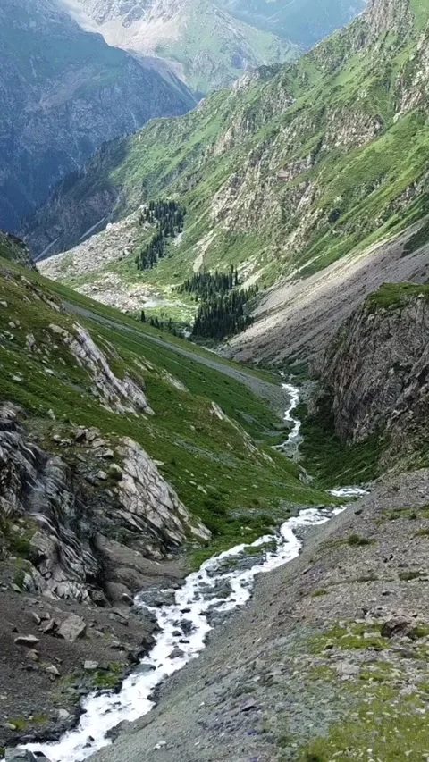 High angle view of winding mountain river in deep rocky gorge with steep slopes Video stock 336691790