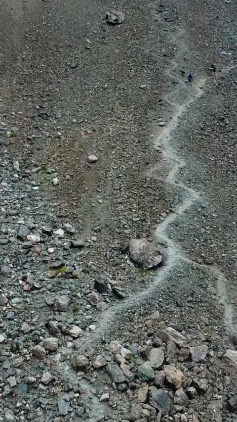 High angle view of winding zig-zag hiking trail on steep rocky mountain slope Stock Footage 336684850