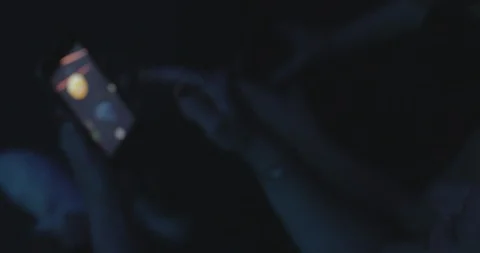 High angle view of woman using app in smart phone while enjoying at nightclub Stock Footage 120158837