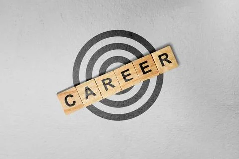 A high-angle view of wooden blocks spelling out 'CAREER' over a target symb.. Stock Photos