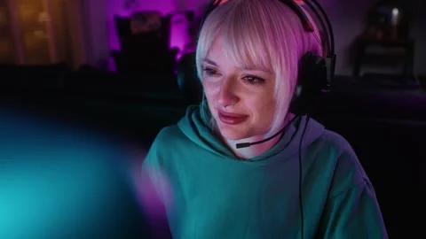 High angle view of young caucasian woman playing game at night on Desktop PC Video stock 244467721