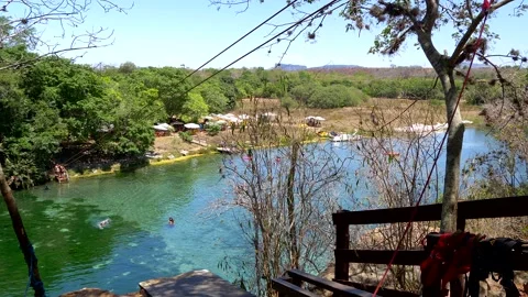 High angle view of zip line and tourists relaxing and swimming Stock Footage 165552501