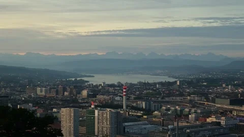 High angle view of Zurich cityscape with Lake Zurich as camera pans left Vídeo Stock 345815695