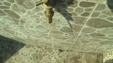 HIGH ANGLE: WATER FLOWS FROM FAUCET Stock Footage 59865195