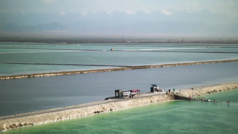 High-Angle Wide-Angle Aerial View of Mangya Emerald Lake and Kunlun Mountains Stock Footage 343798275
