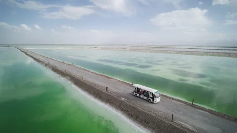 High-Angle Wide-Angle Aerial View of Mangya Emerald Lake and Kunlun Mountains 動画素材 343798957