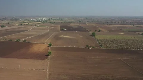 High angle wide drone perspective of patchwork agricultural terrain showing vast Video stock 337547769