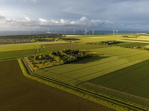 High angle wide horizontal aerial drone photograph of polder fields Фото