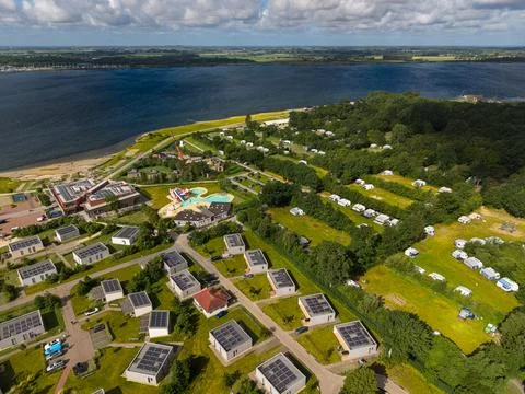 High angle wide horizontal aerial drone photograph of lakeside holiday Stock Photos