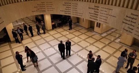High angle wide shot lobbyists waiting in Florida's Capitol lobby 2019 session Stock Footage 107568992