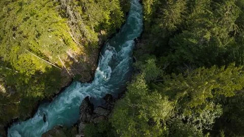 High angle wide shot looking down at swirling white water river canyon rapids Stock-Fotos