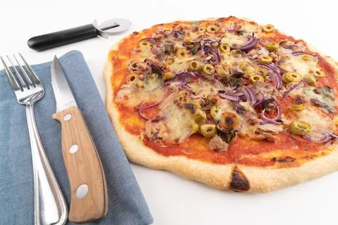 High angle wide studio shot of freshly baked pizza al tonno isolated on white Stock Photos