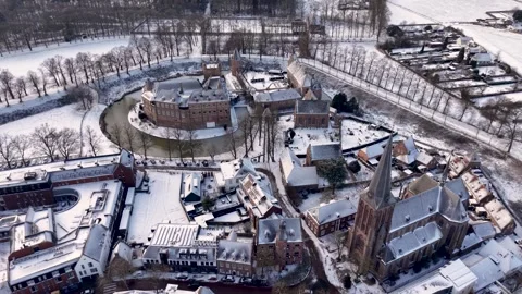 A high angle winter aerial view of a historic moated castle nestled Video stock 329429205