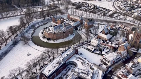 A high angle winter aerial view of a historic moated castle nestled Stock Footage 331281767