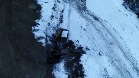 High Angle Winter Excavator Drone Shot Stock Footage 146613142