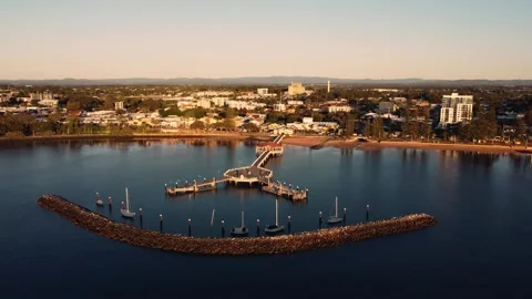 High anit-clockwise orbit of Redcliffe Pier at sunrise, 4K Video stock 242407798