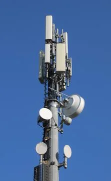 High antenna of the repeater of the cellular network with many devices of r.. Stock Photos