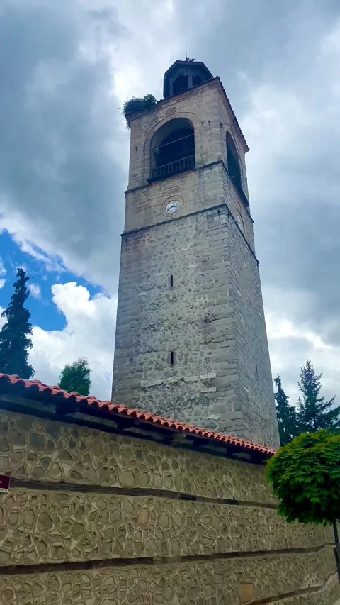 The high bell tower in the small town reaches the sky. Stock Footage 253252713