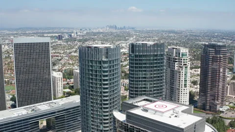 High birds eyes pullback view of Century City buildings and skyscrapers with LA Video stock 274018197