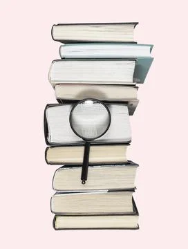 High books stack with magnifying glass. Research conducting, important data Foto stock