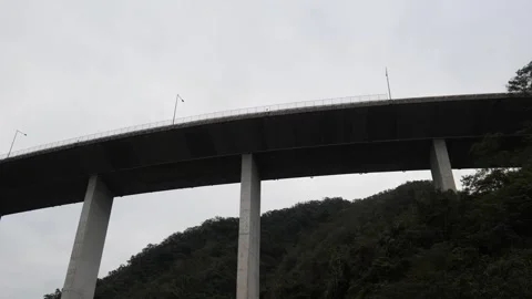 High Bridge Impressive Construction Going Through Mountains 4K Video 스톡 동영상 295770419