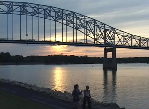 High Bridge over river with traffic silhouettes at sunset Video stock 225951418